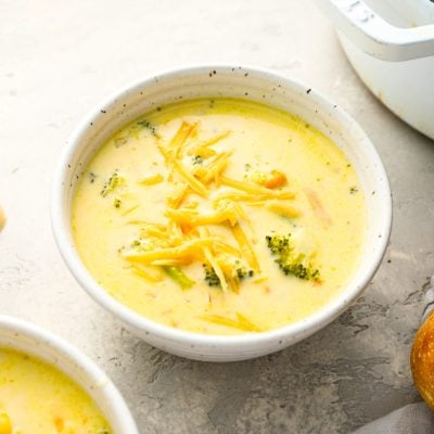 bowls of broccoli cheddar soup topped with cheese