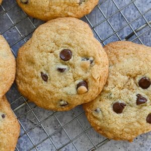Gluten free chocolate chip cookies cooling on a wire rack.