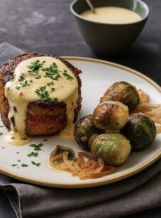 steak au poivre on plate with Brussels sprouts