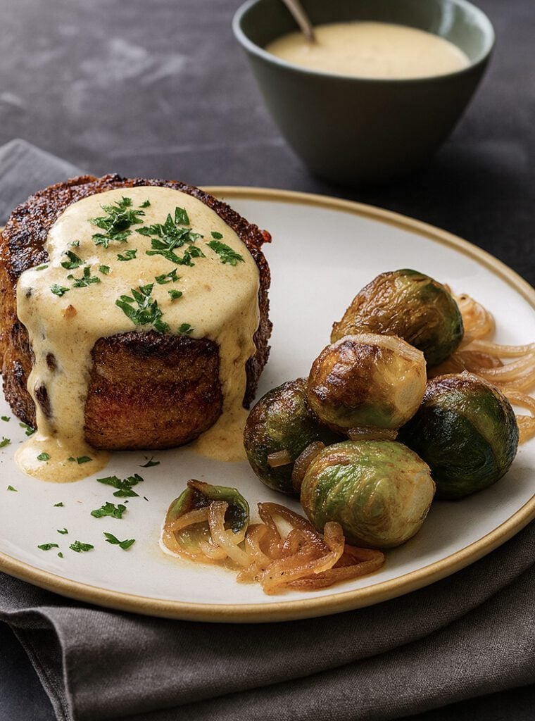 steak au poivre on plate with Brussels sprouts