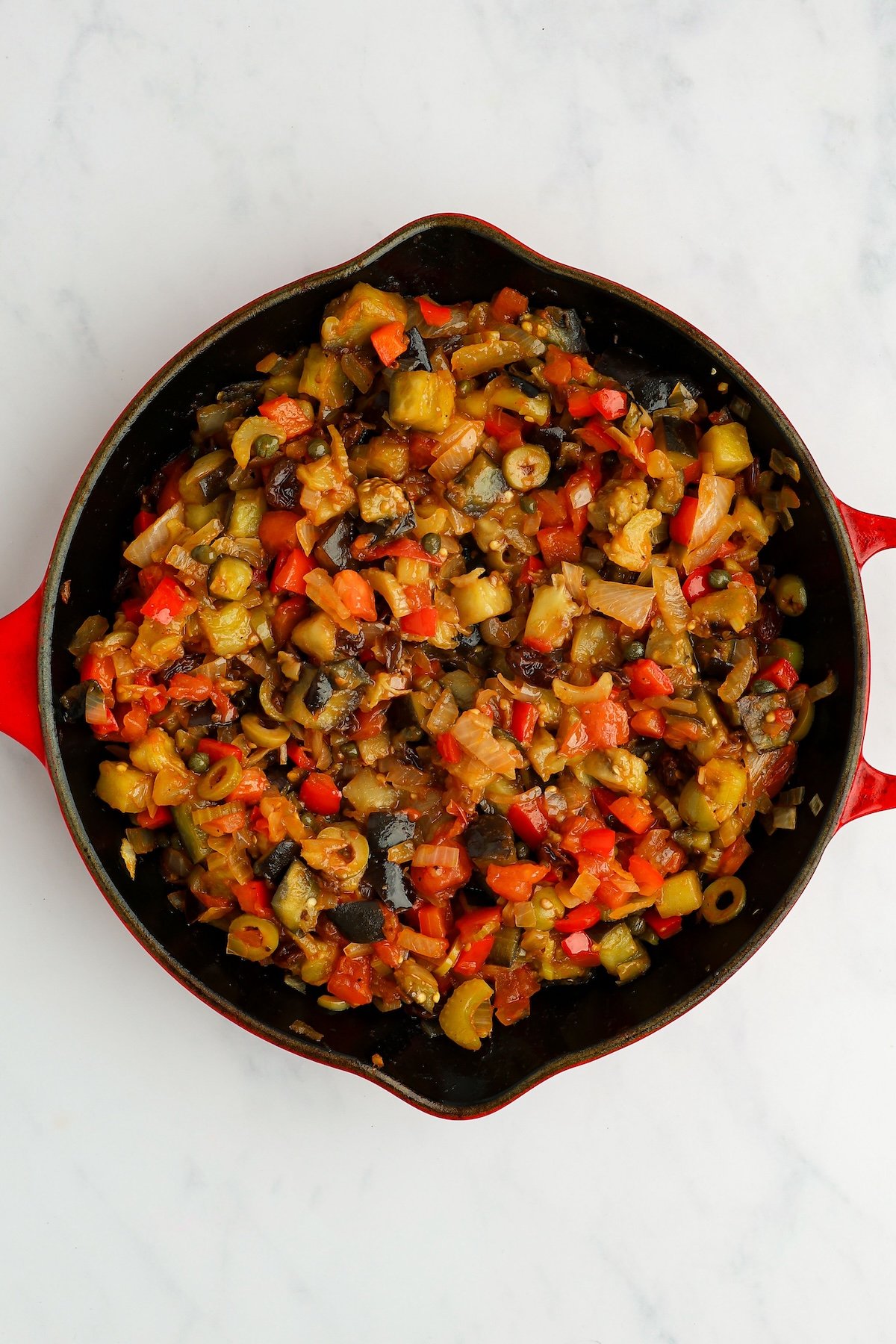 large skillet with vegetable mixture sitting at room temperature 