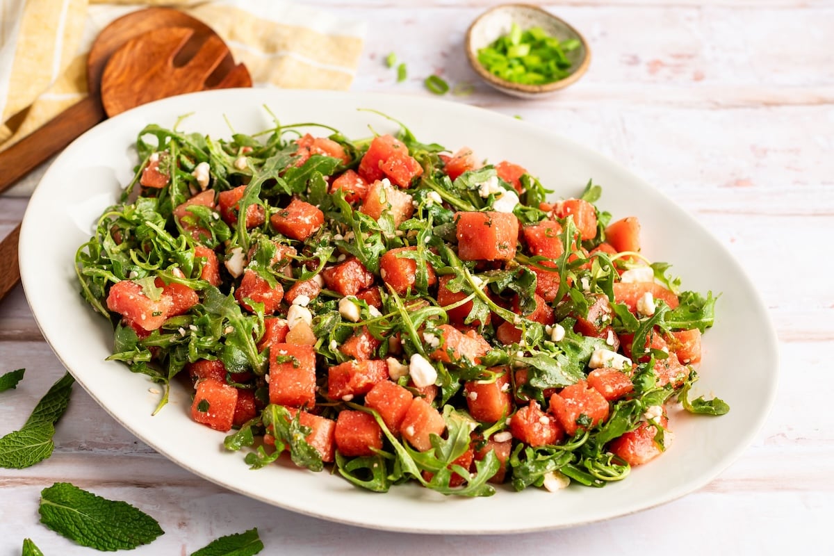 watermelon feta salad on white oval serving platter