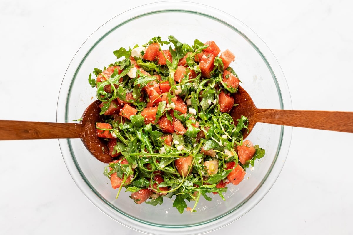 watermelon feta salad tossed together in large bowl