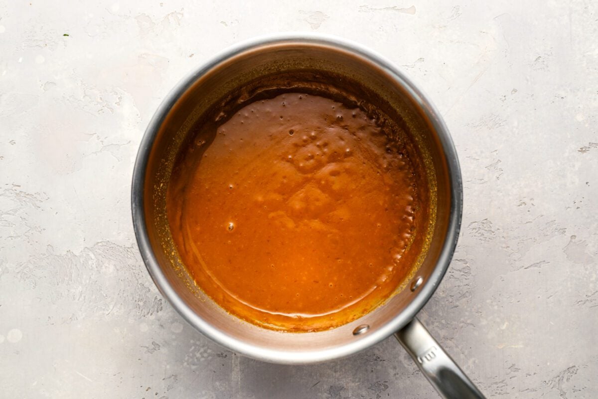 thicken mixture of coconut milk, peanut butter, brown sugar, curry paste, sriracha, soy sauce (or fish sauce), and lime juice in small saucepan