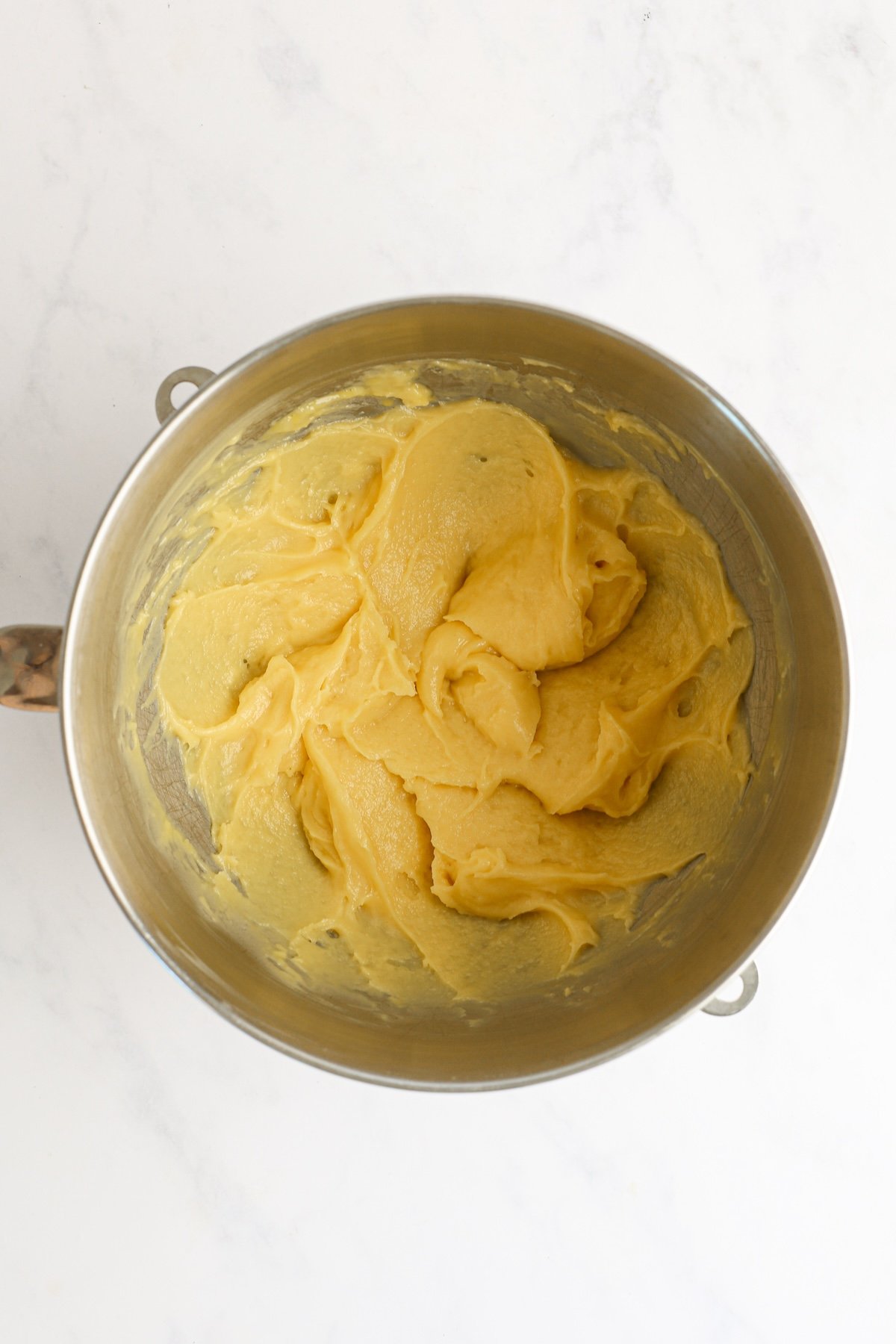 dough in mixing bowl with eggs mixed in