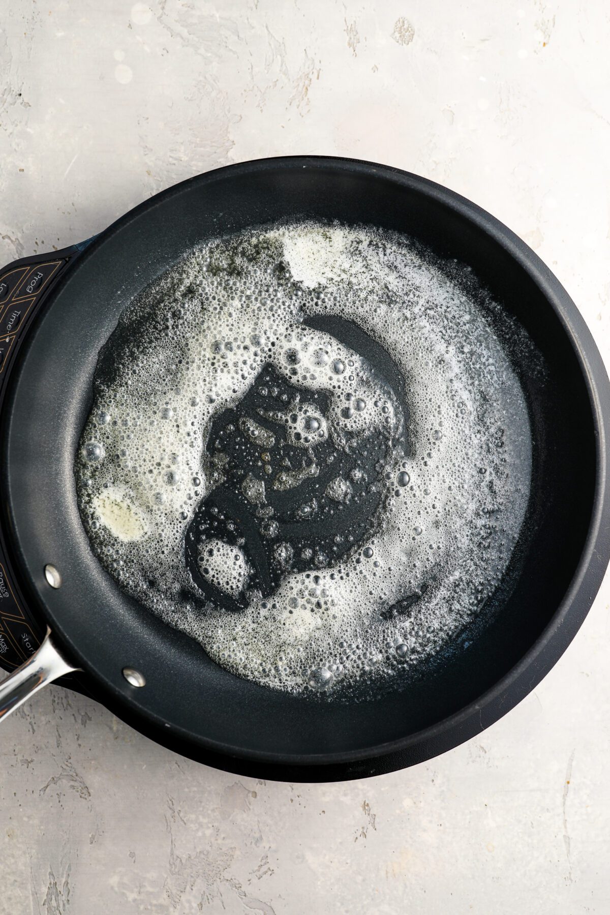 oil and melted butter in cast iron skillet
