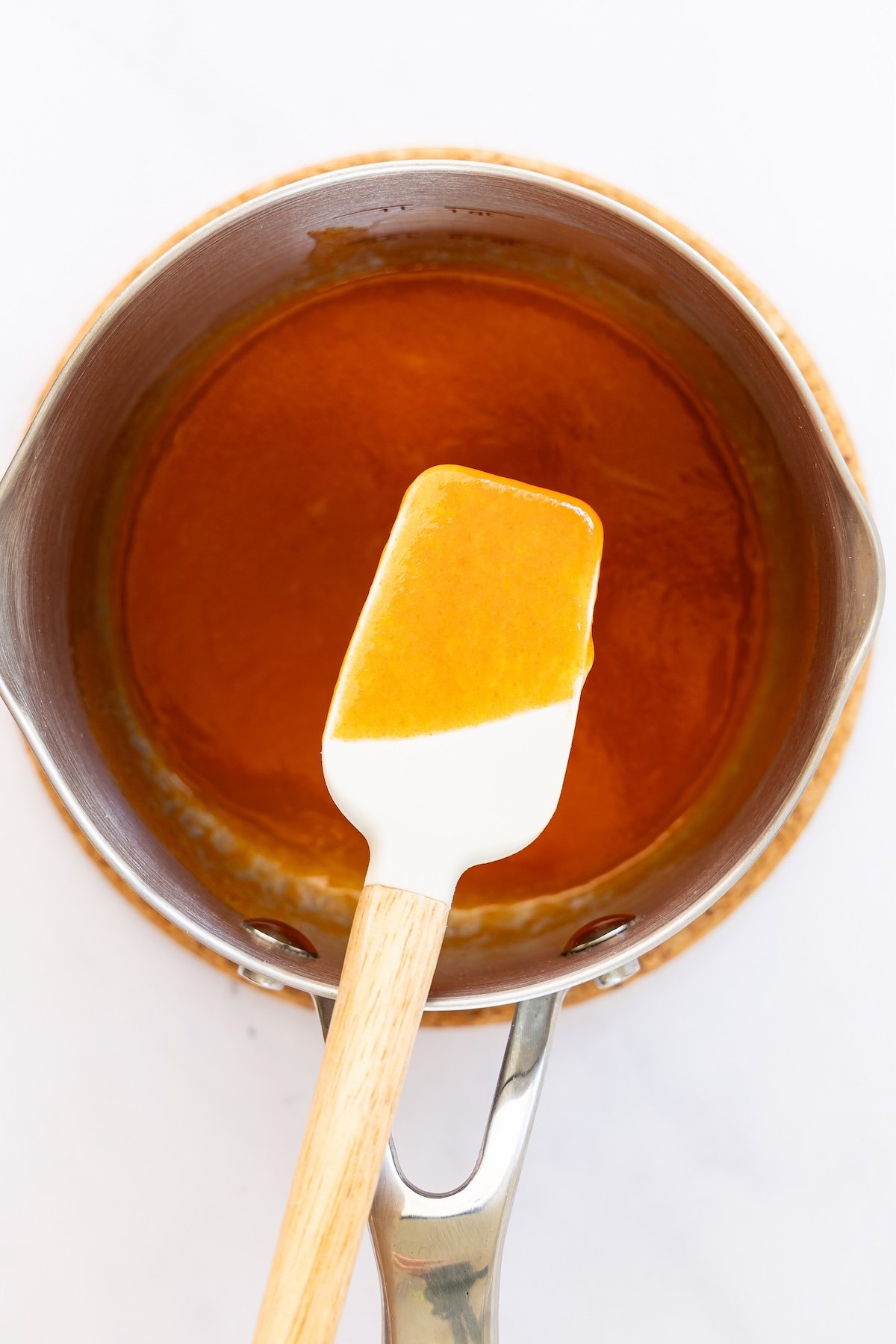 saucepan with melted butter and hot sauce mixture