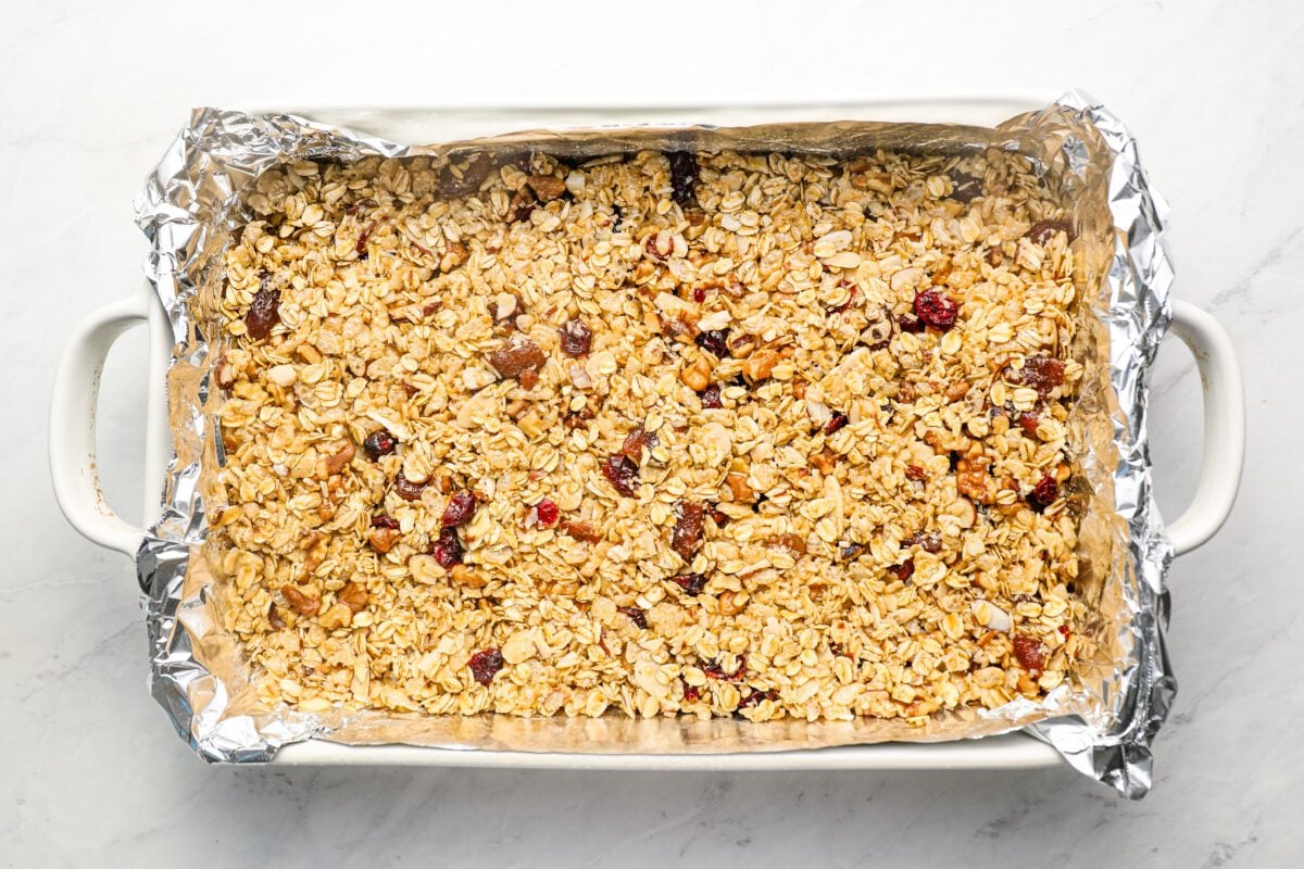 foil-lined baking dish with granola bar mixture