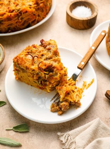 A wedge of spaghetti pie on a plate.