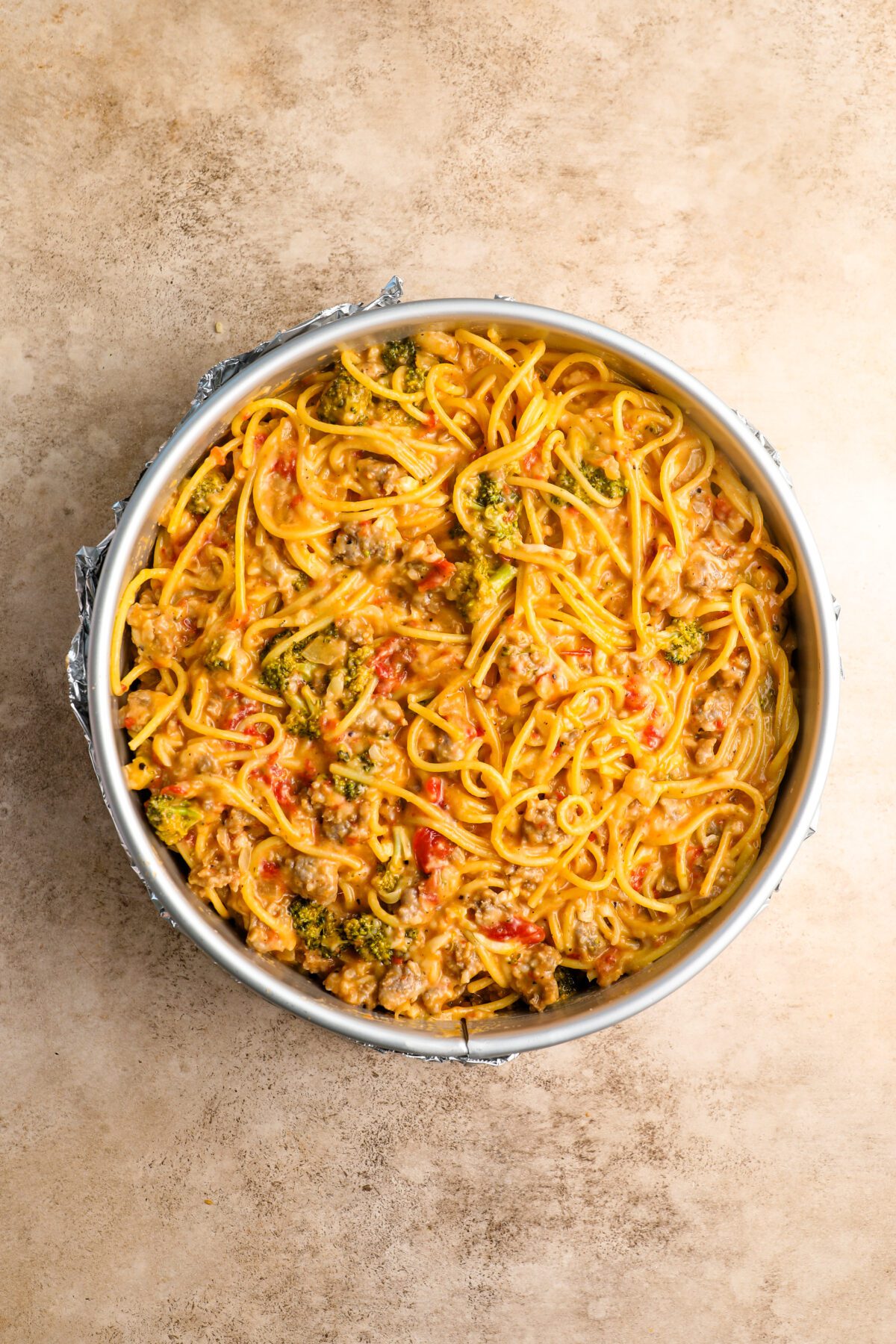 spaghetti pie mixture in springform pan