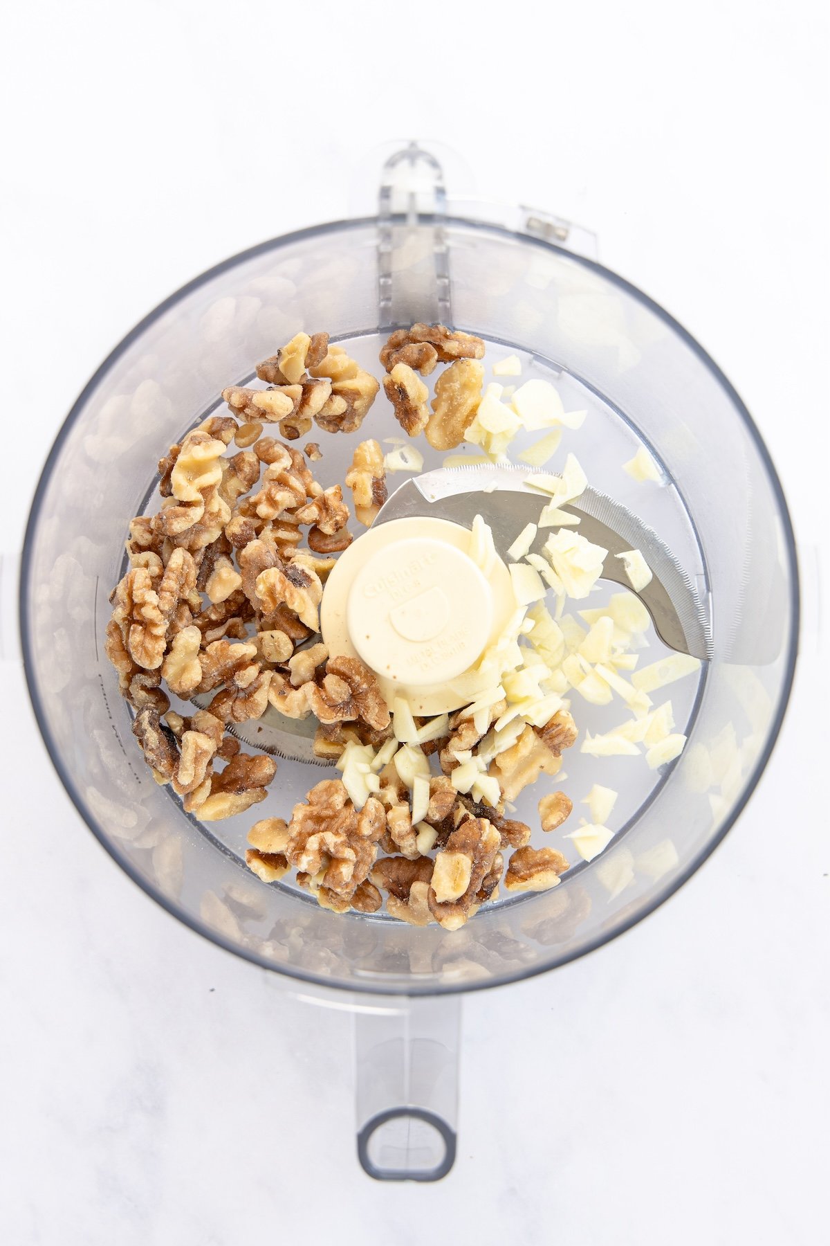 walnuts and garlic in food processor