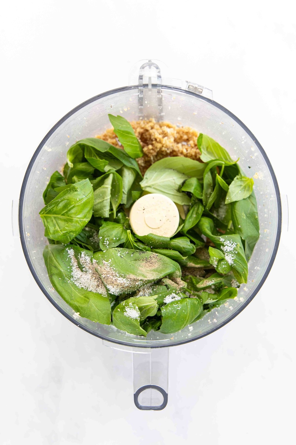 basil added to walnut mixture in food processor