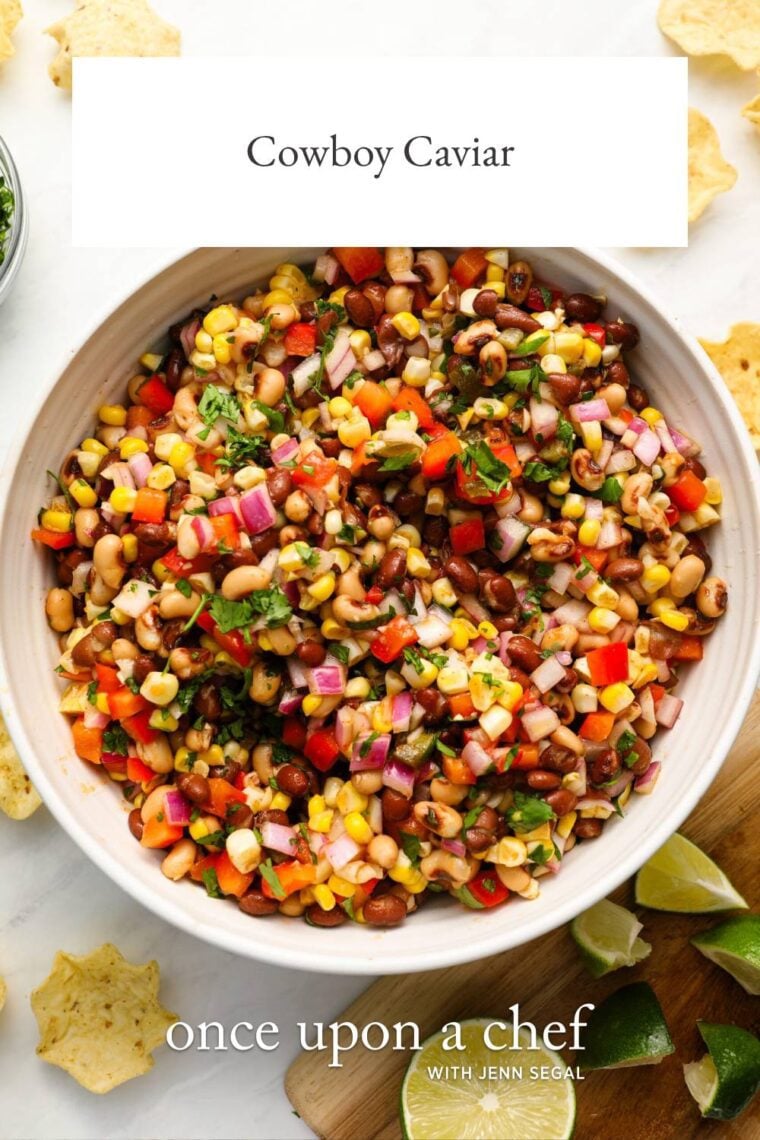 tortilla chips around white serving bowl with cowboy caviar