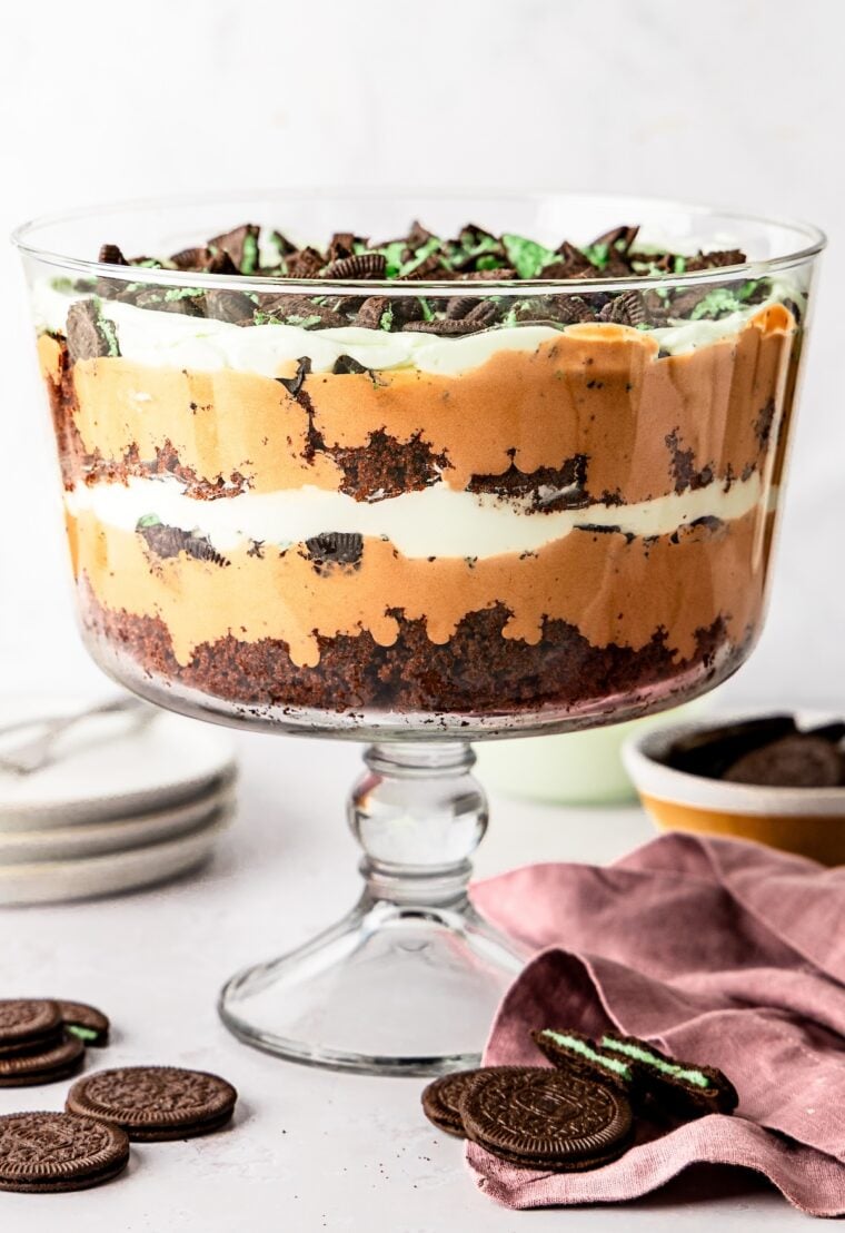 Chocolate mint trile in trifle dish with chocolate mint cookies nearby