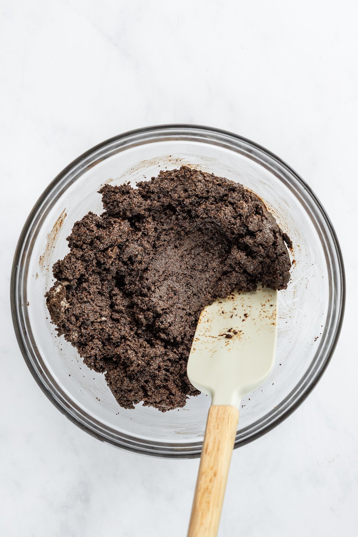 medium bowl with cookie crumbs combined with chocolate/butter mixture