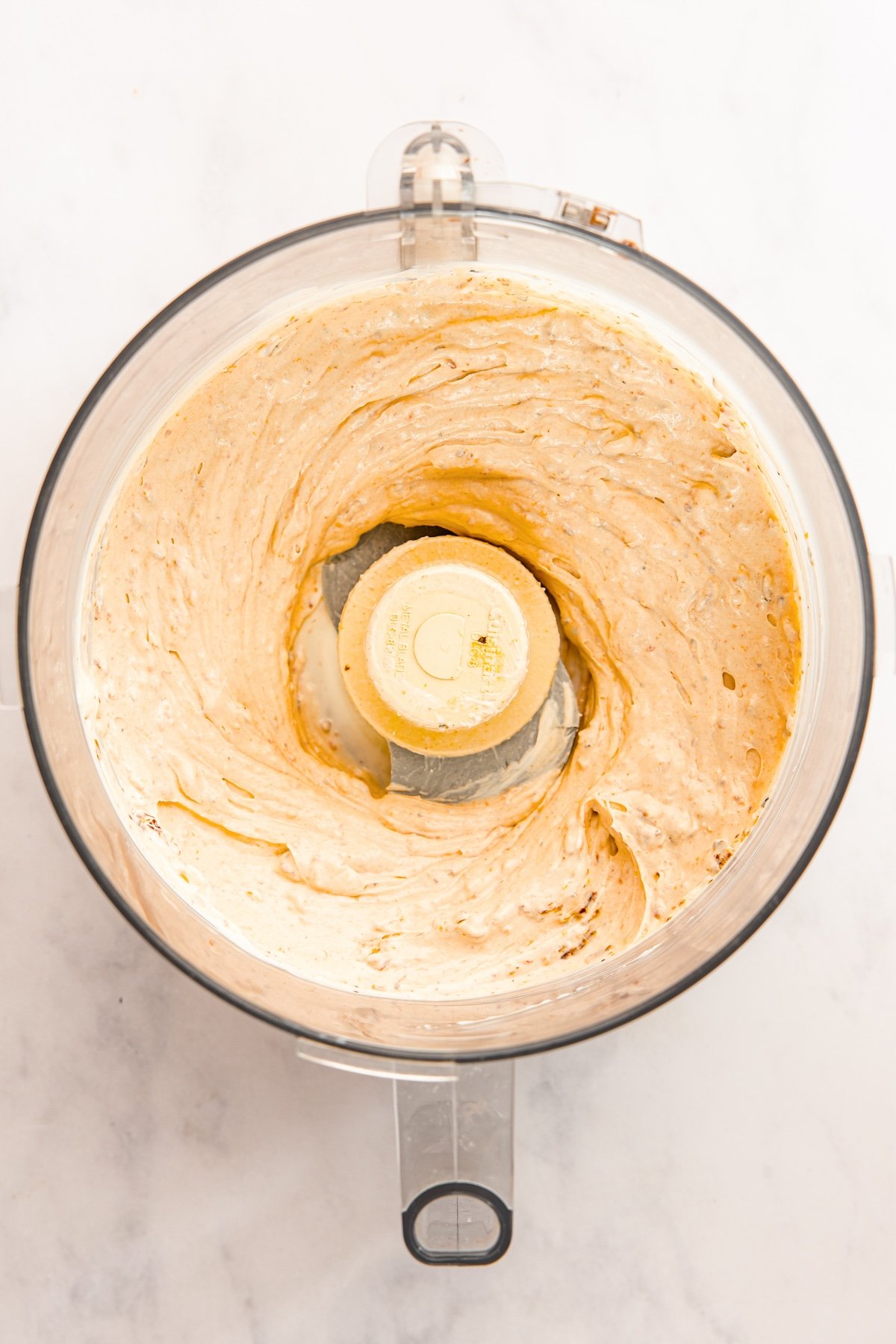 sun-dried tomatoes, cream cheese, sour cream, mayonnaise, Tabasco sauce, salt, and pepper blended together in food processor