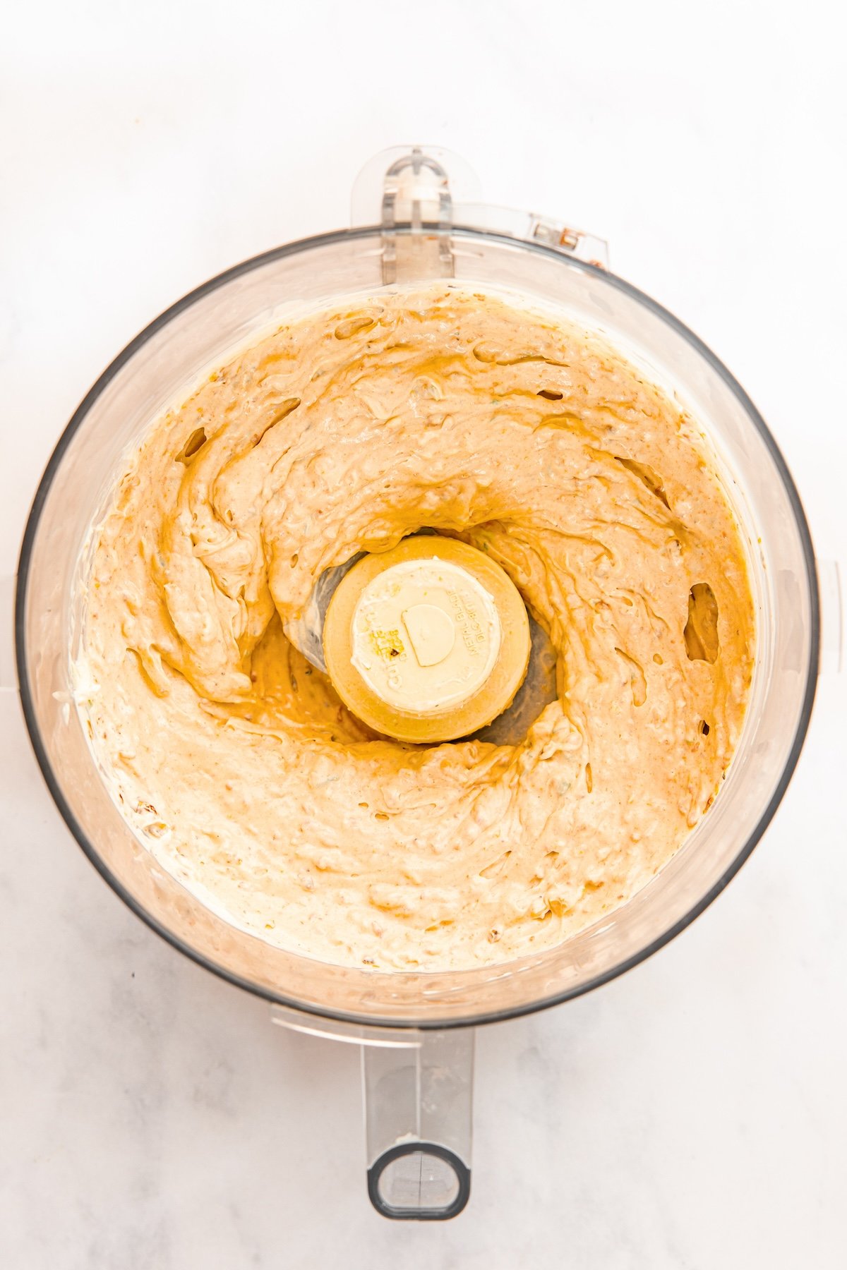 food processor with fully blended sun-dried tomato dip 