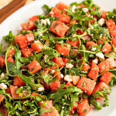watermelon feta salad on white oval serving platter