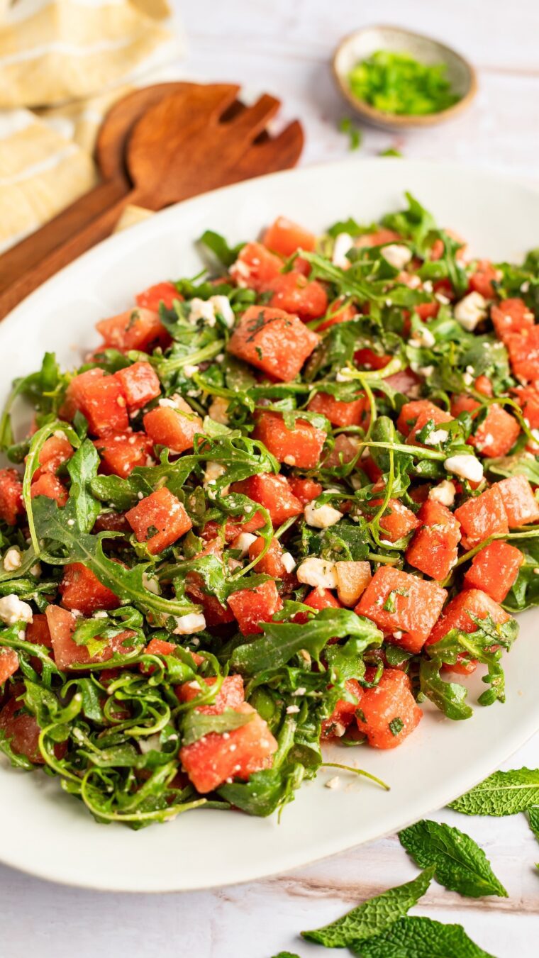 watermelon feta salad on white oval serving platter