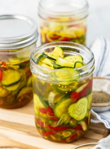 3 jars filled with bread and butter pickles