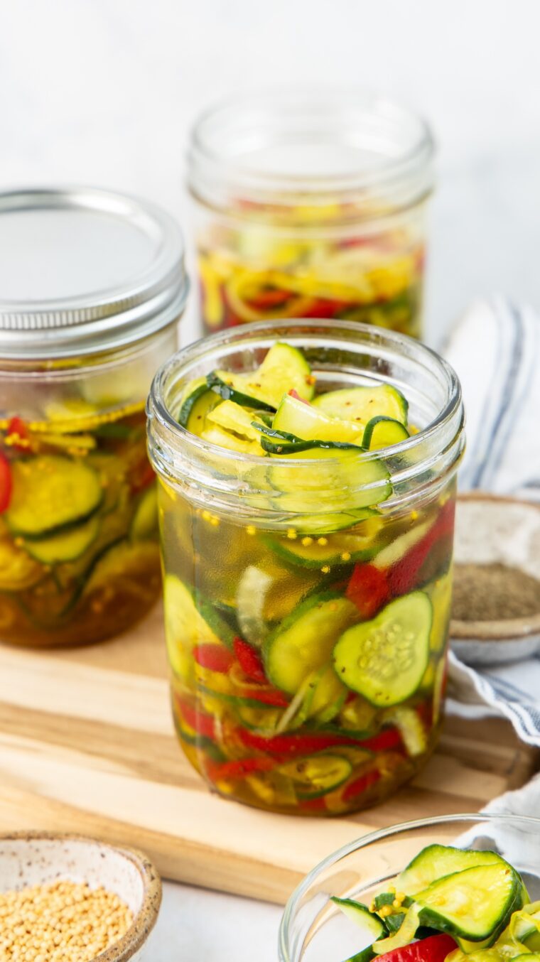 3 jars filled with bread and butter pickles