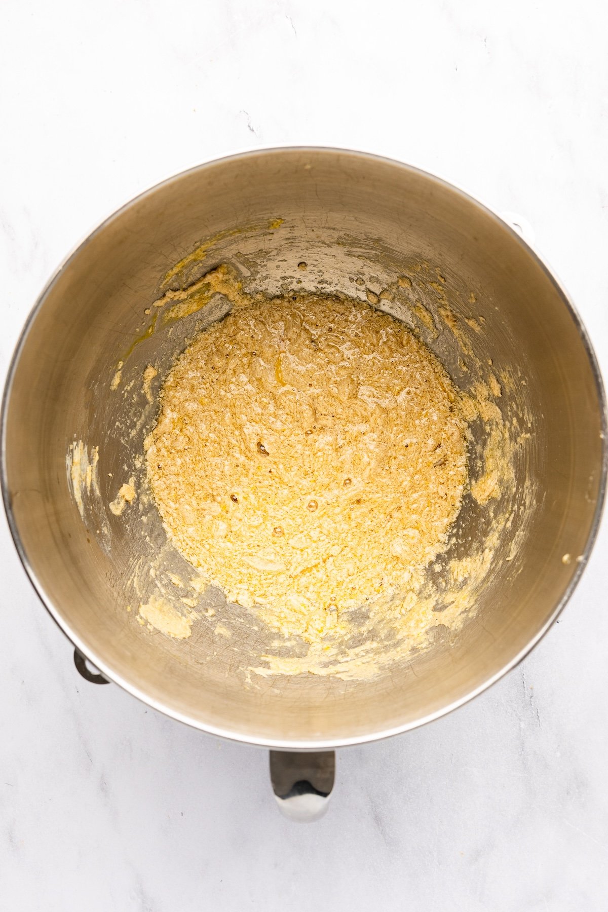 mixing bowl with 3 eggs combined with butter/sugar mixture