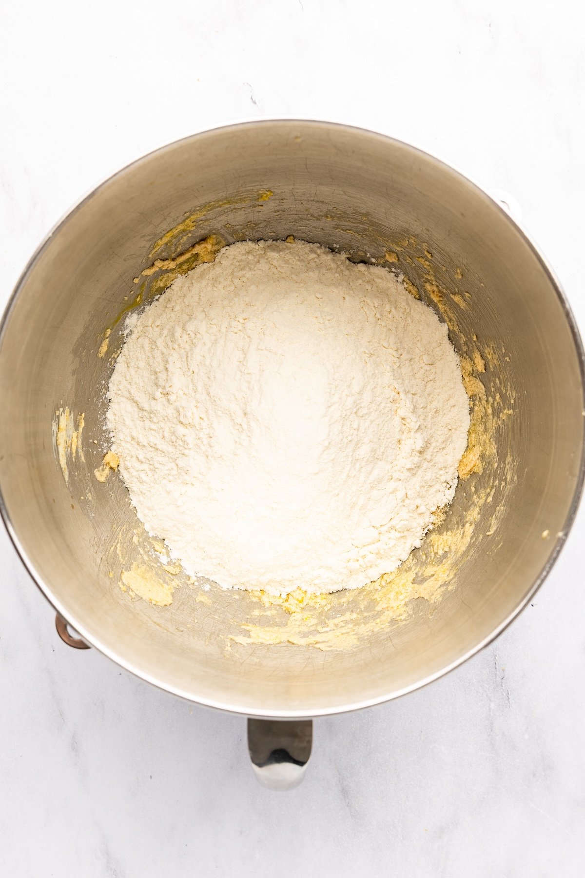 mixing bowl with flour added to batter