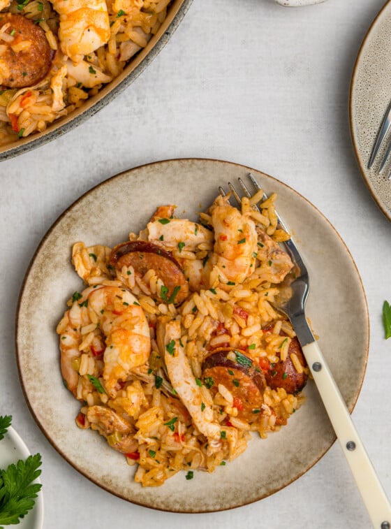 jambalaya on grey plate with fork