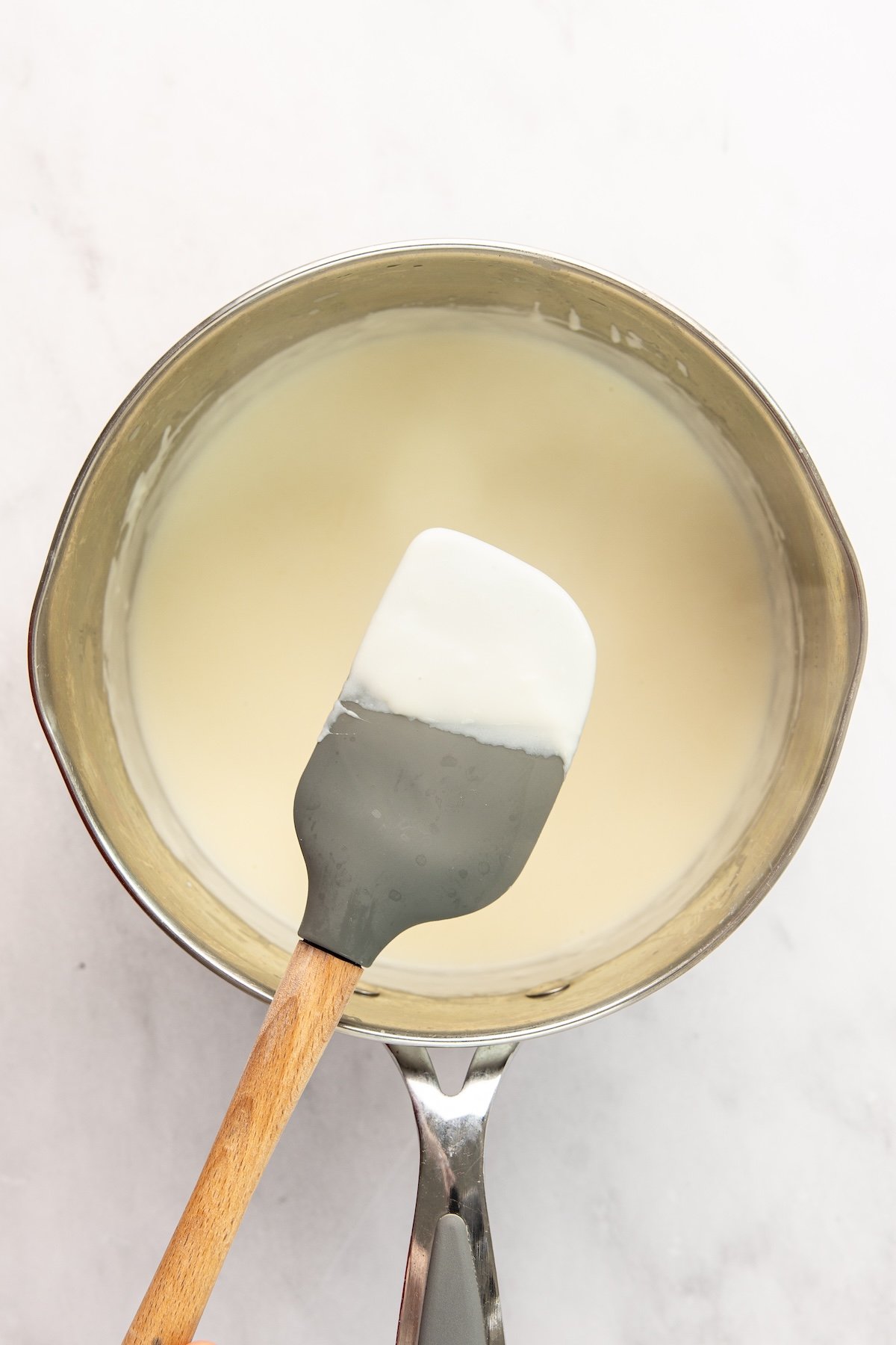 fully combined, thickened milk/butter flour mixture in medium saucepan