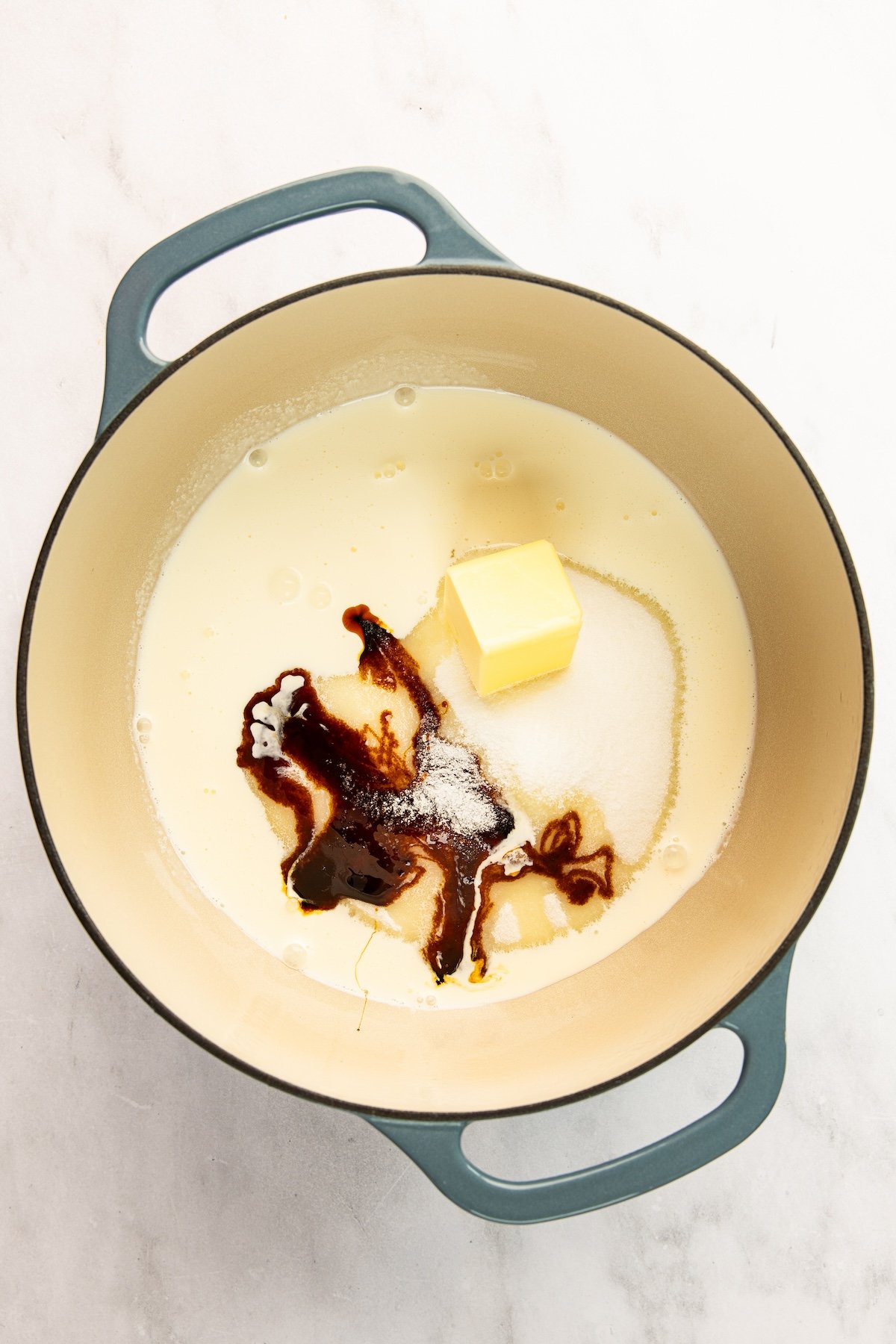 sugar, cream, molasses, butter, and salt in 5-quart Dutch oven