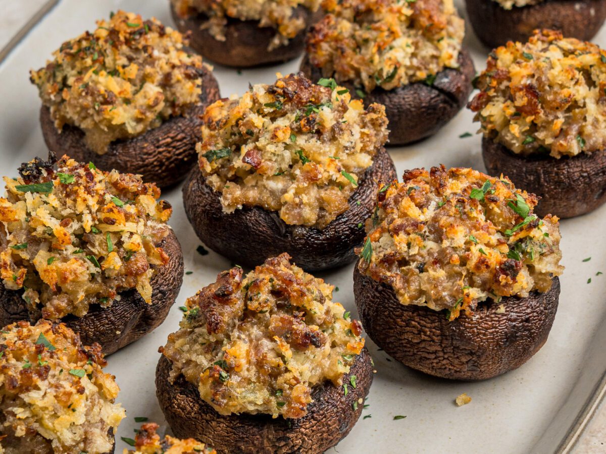 baked stuffed mushrooms on white serving plate