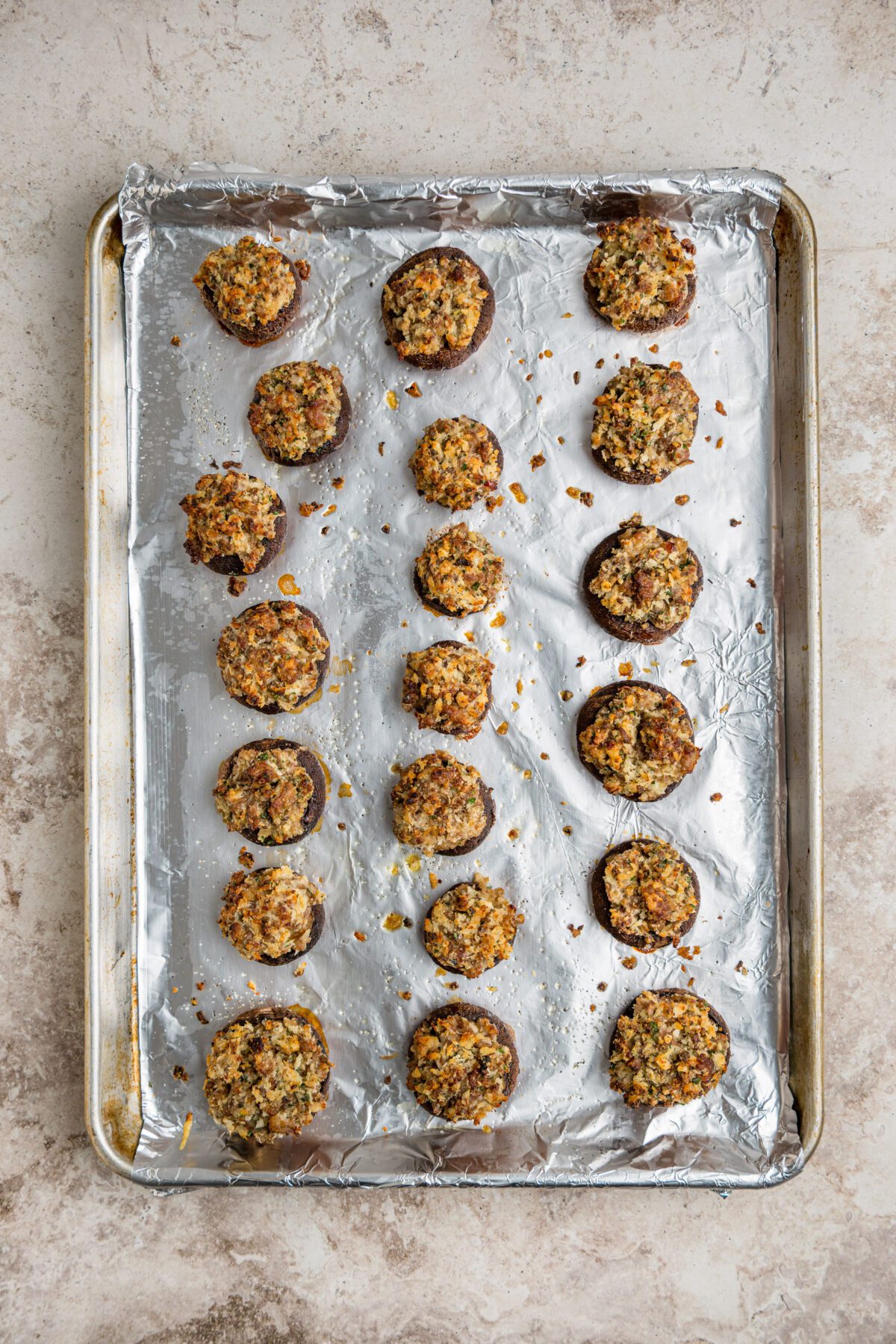 baked stuffed mushrooms on baking sheet
