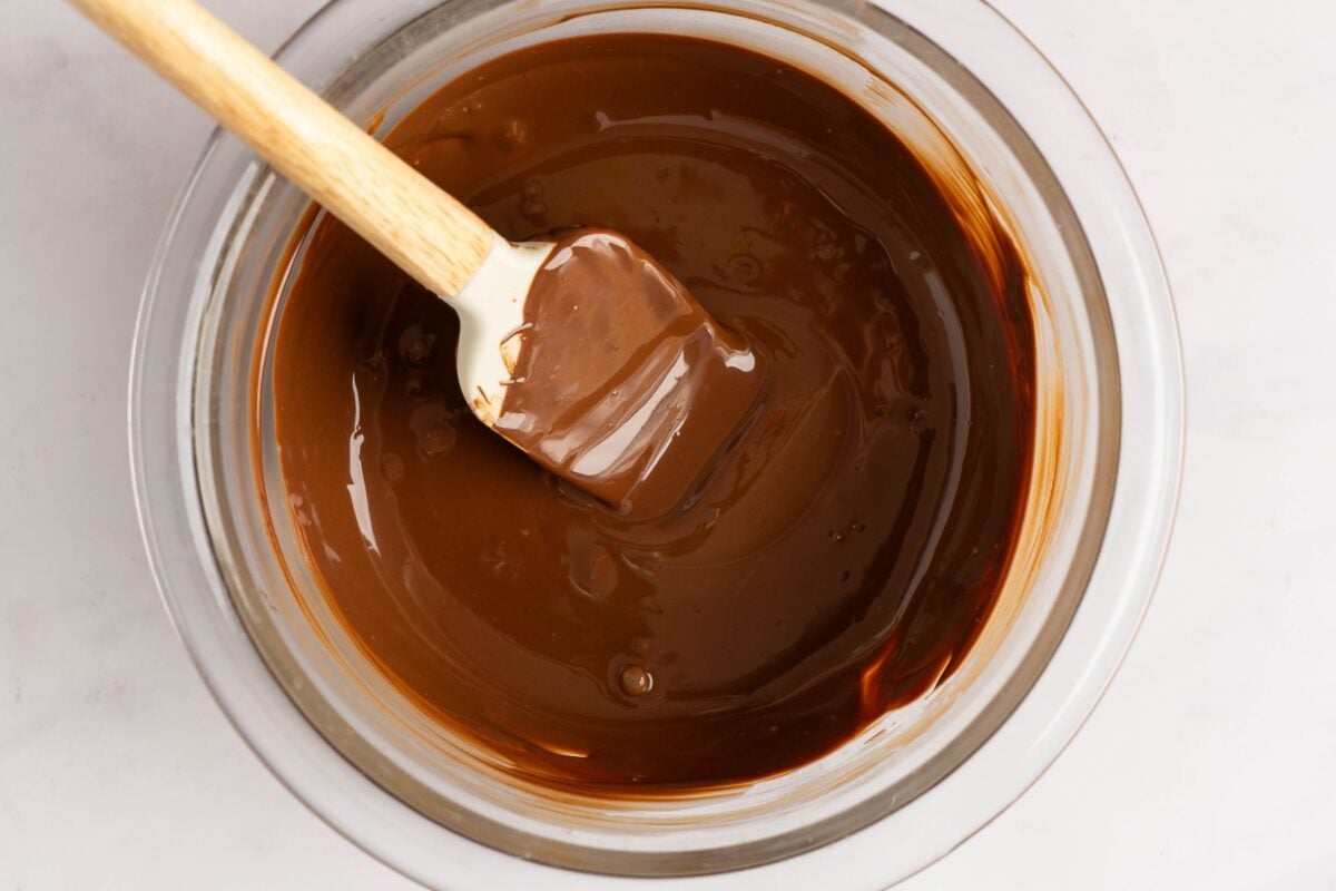 melted chocolate in bowl with rubber spatula