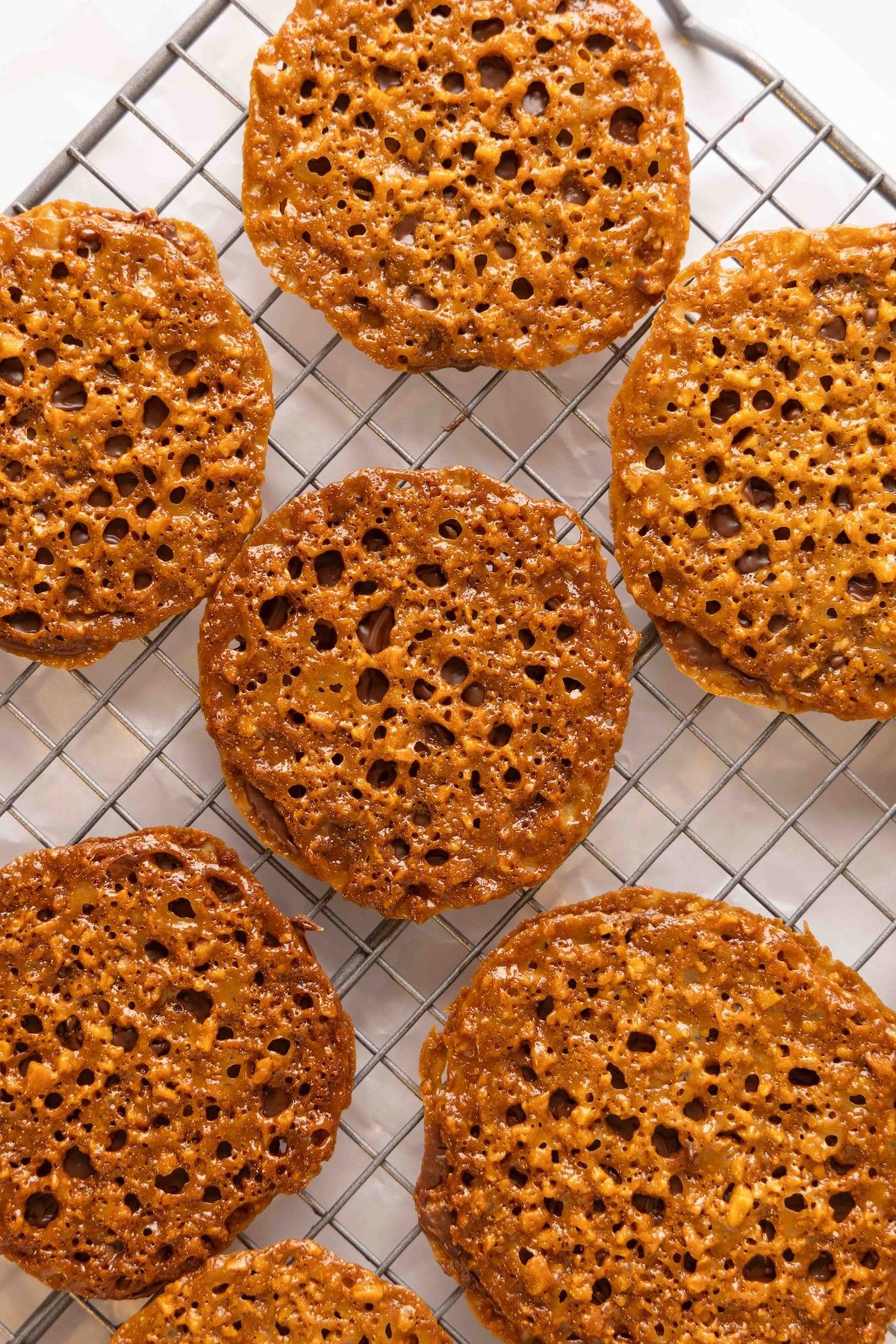 finished, chocolate-filled cookies on cooling rack