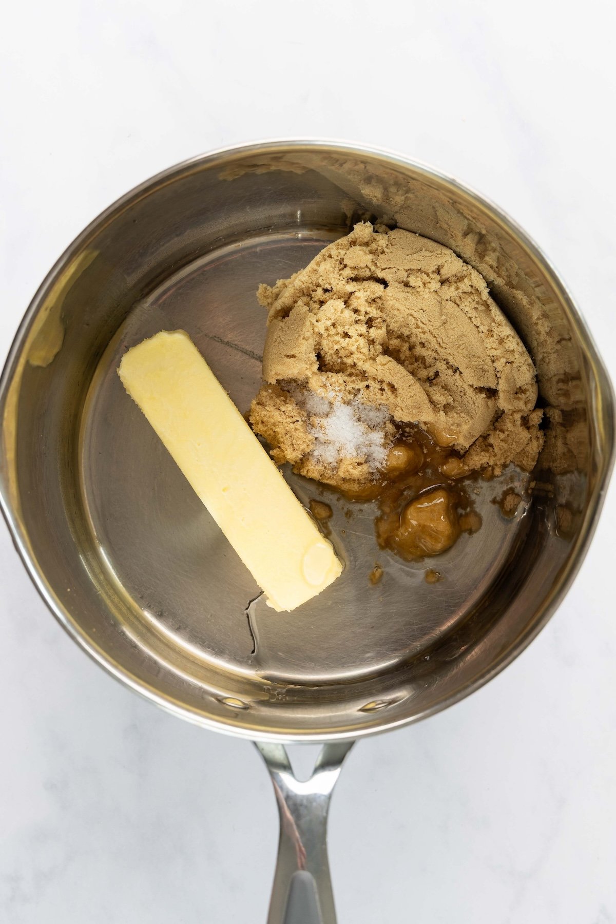 butter, sugar, corn syrup, and salt in saucepan