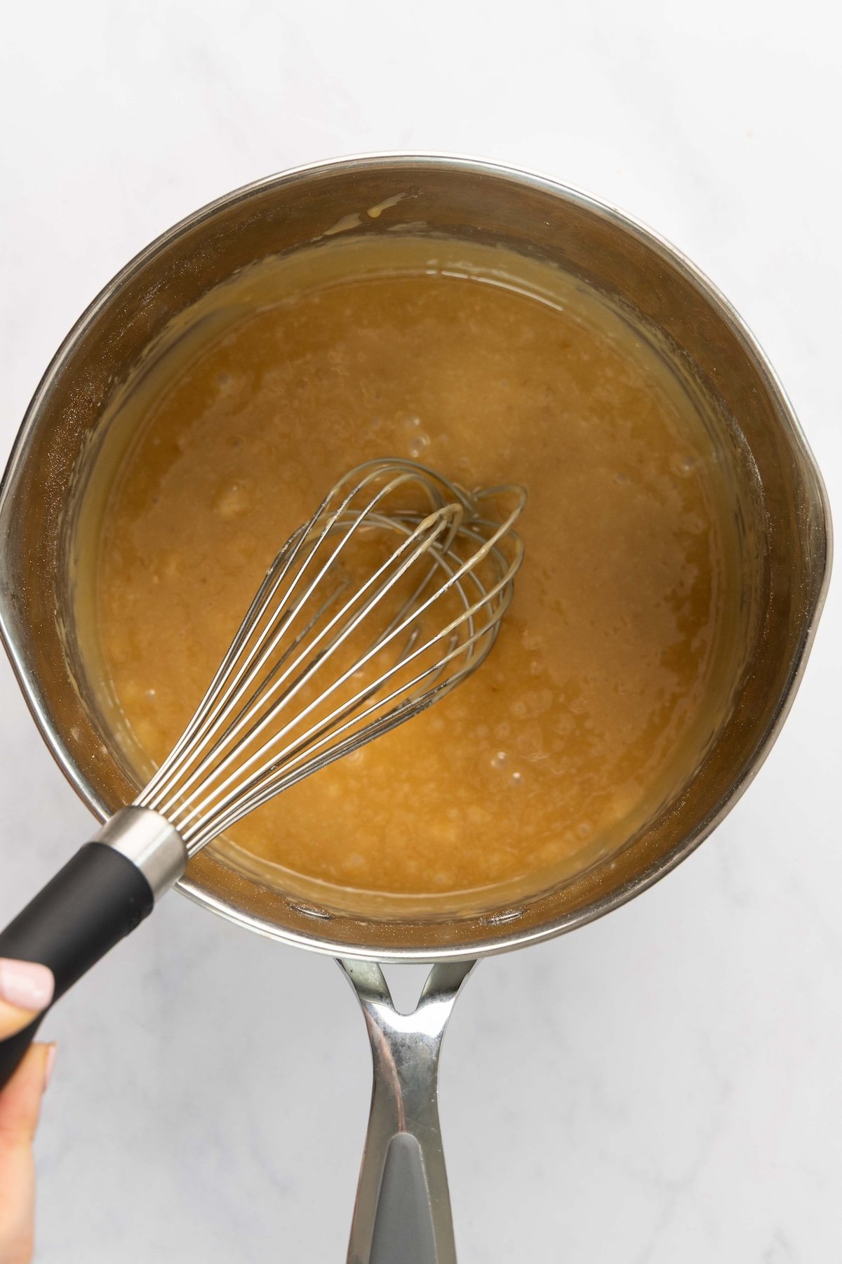 flour and vanilla whisked into butter, brown sugar, corn syrup, and salt mixture