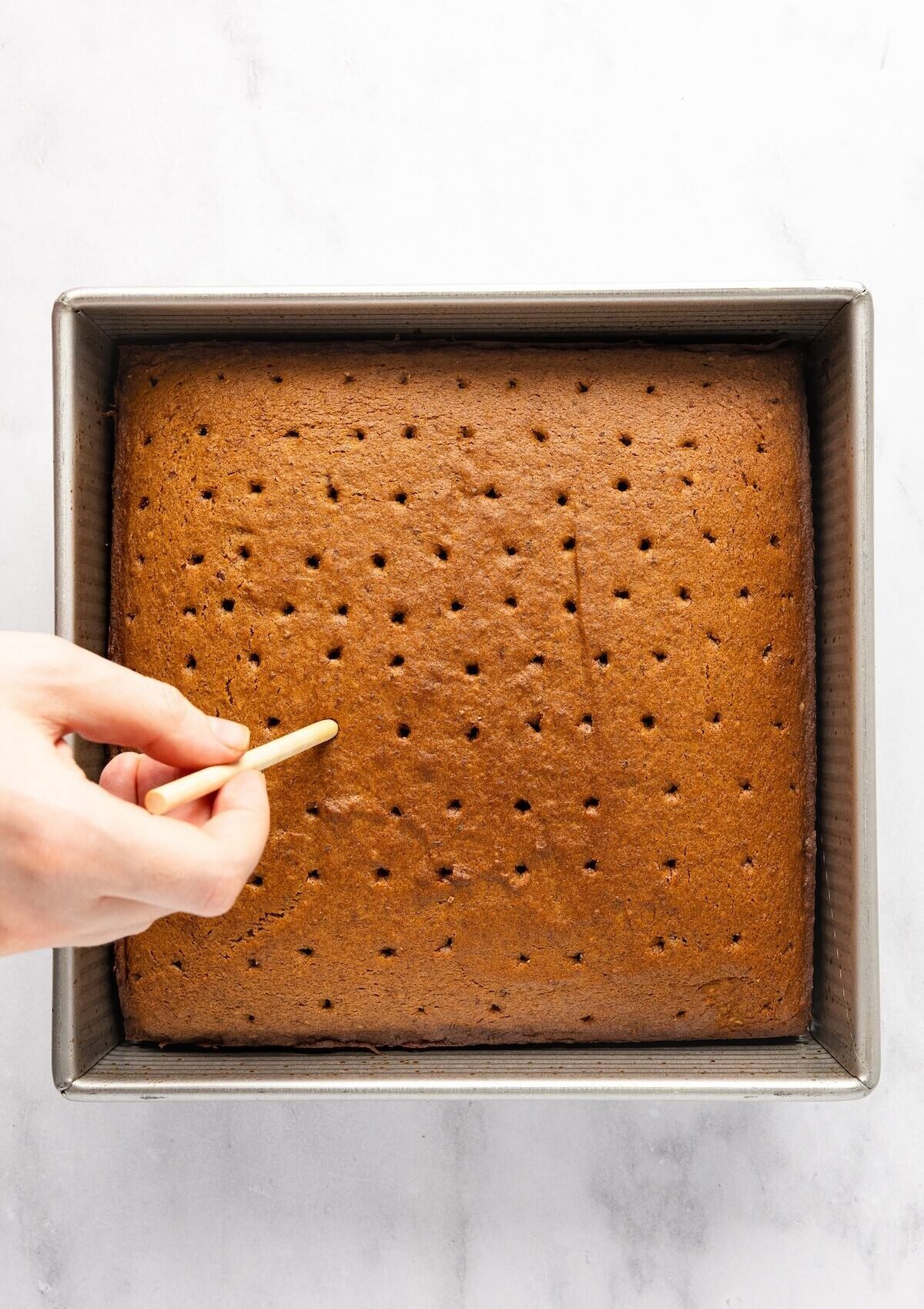 poking holes in cake