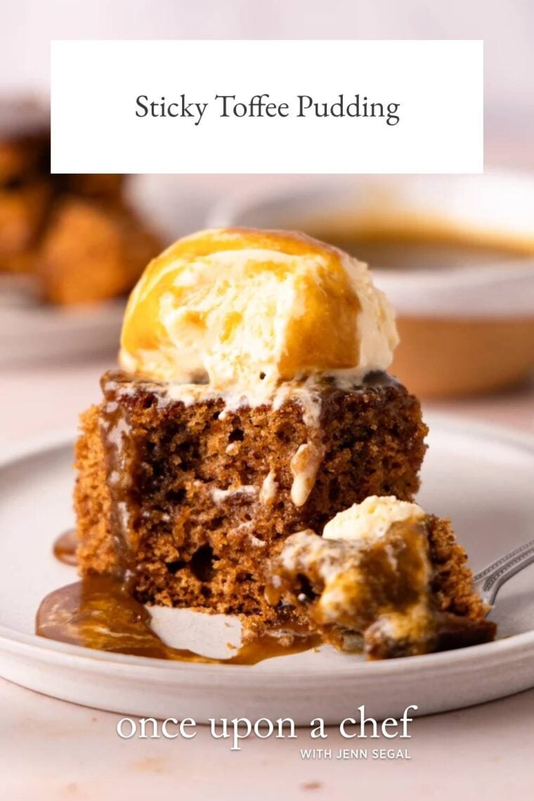 white plate with square of sticky toffee pudding topped with vanilla ice cream