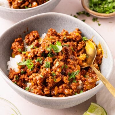 gray bowl with cuban picadillo served over white rice