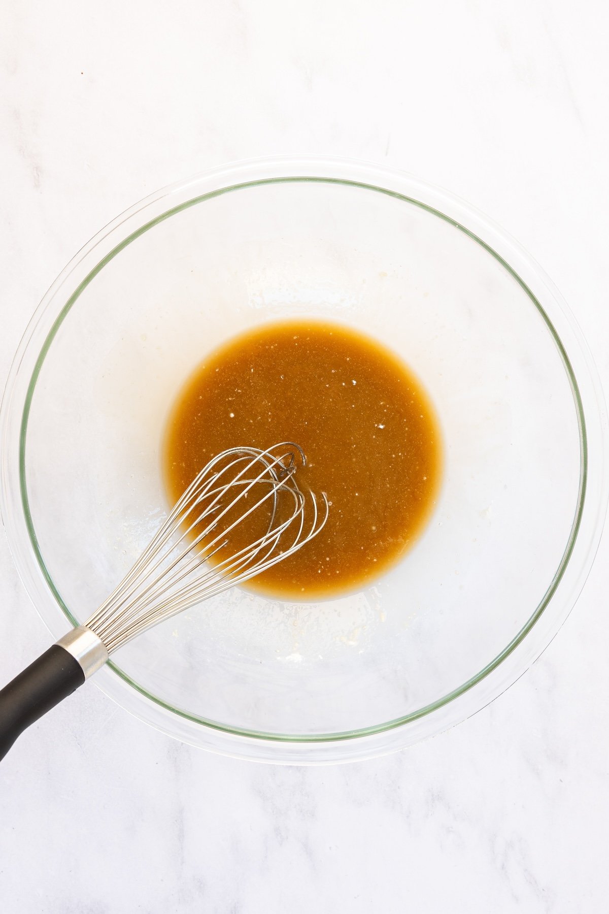 wet ingredients for rum balls in glass bowl