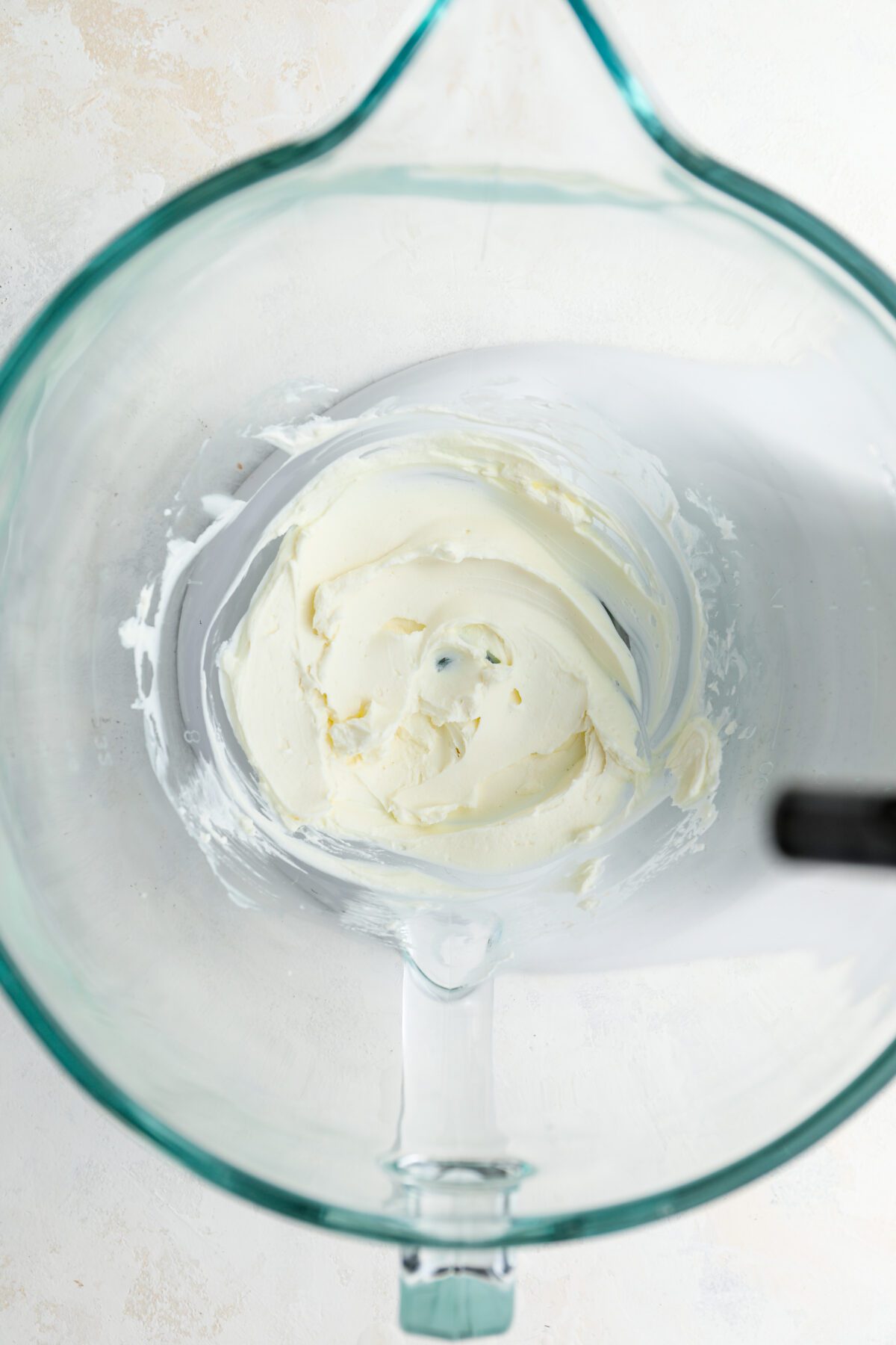 mixing bowl with cream cheese whipped to smooth consistency
