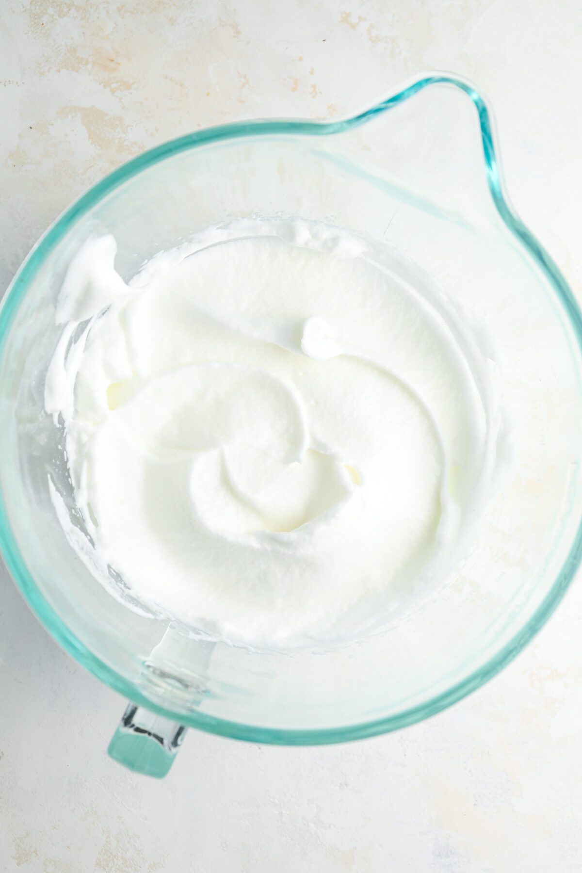medium bowl with sugar combined with whipped egg whites
