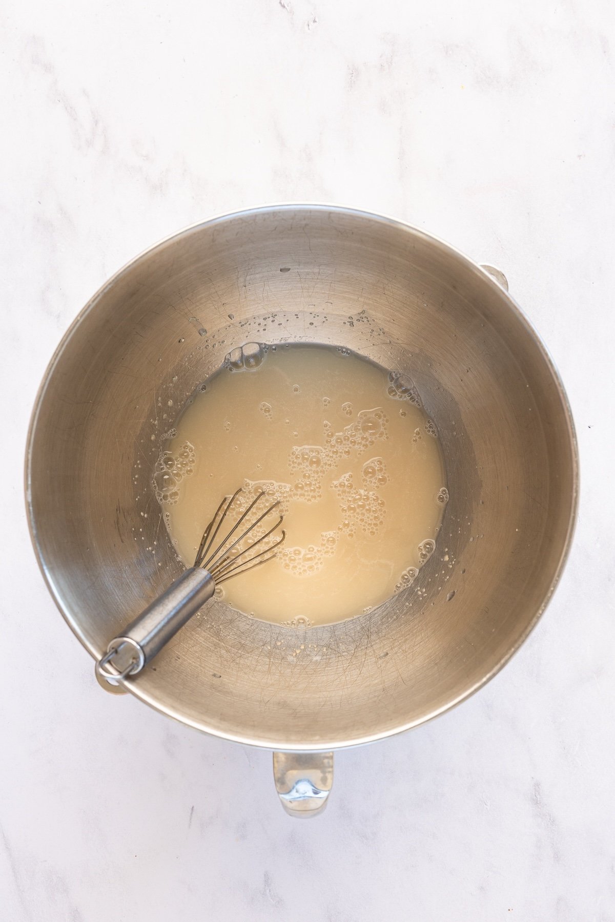 mixing bowl with yeast, warm water, and honey