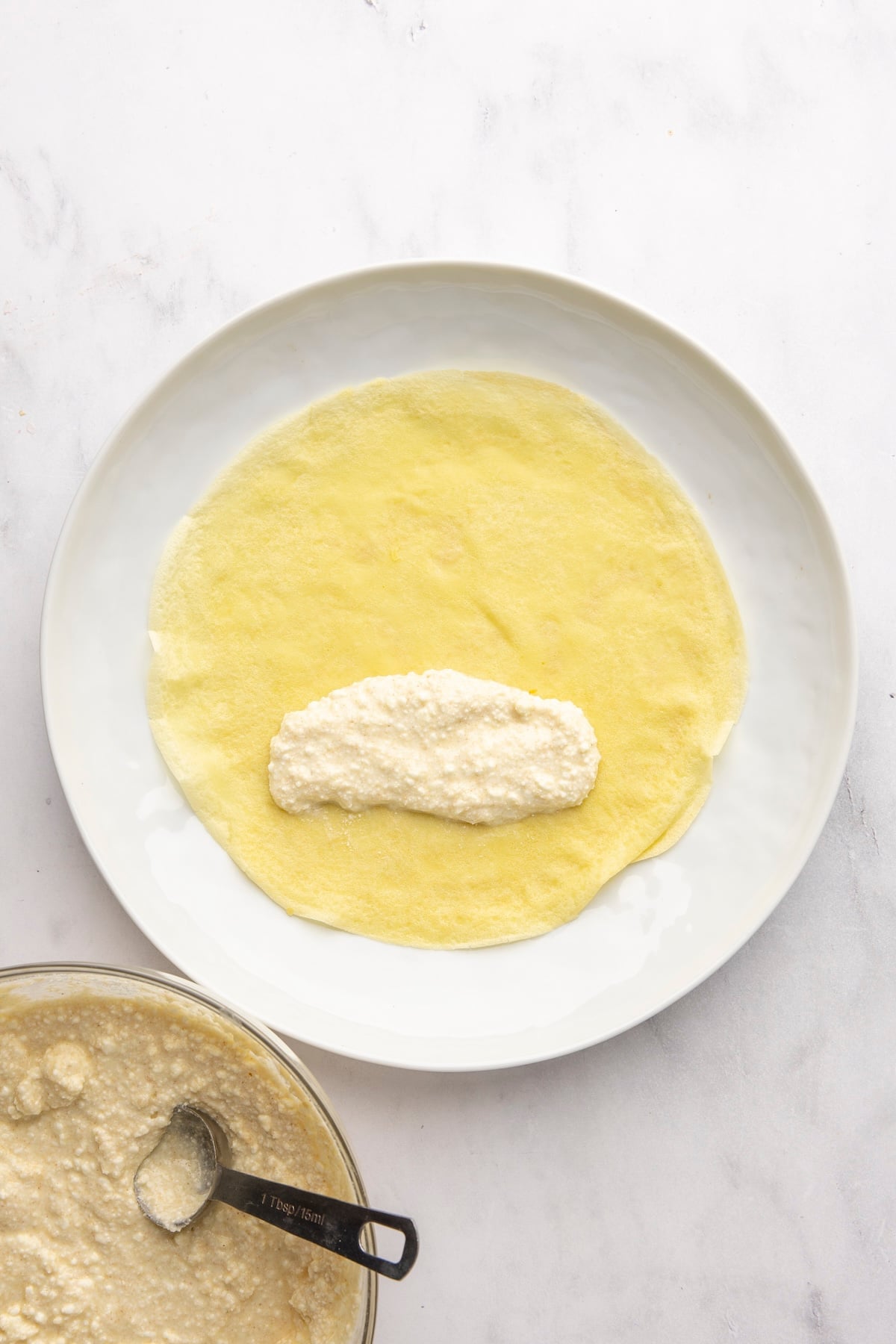 3 tablespoons filling placed 2 inches from the bottom edge of crepe