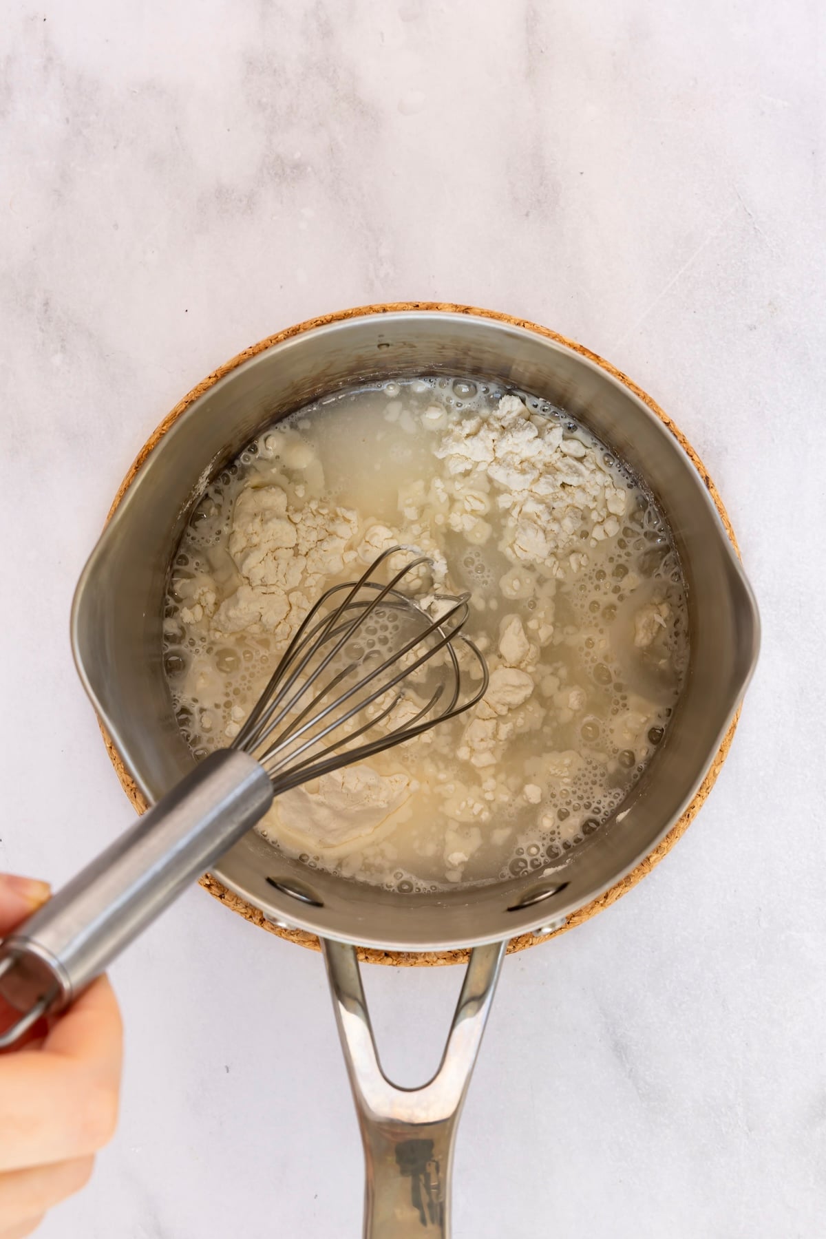 whisking water and flour