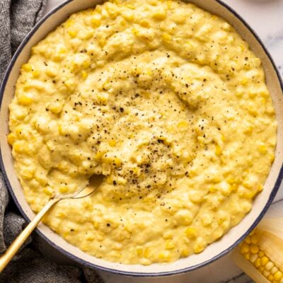 creamed corn in bowl with fresh black pepper