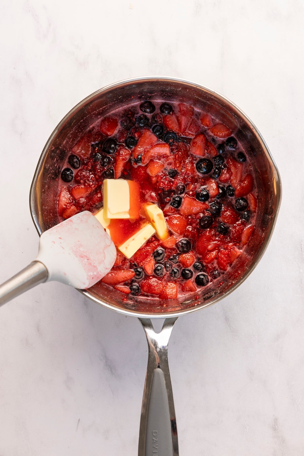 butter and lemon juice added to berry/sugar mixture in medium saucepan. 
