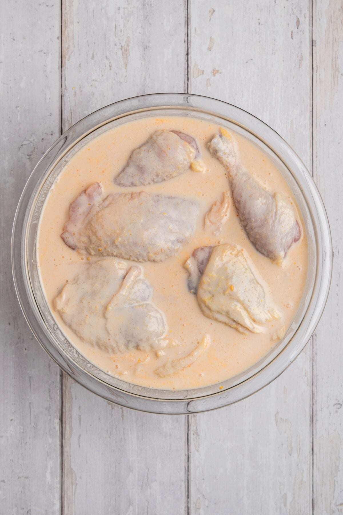 bowl with chicken pieces in brine