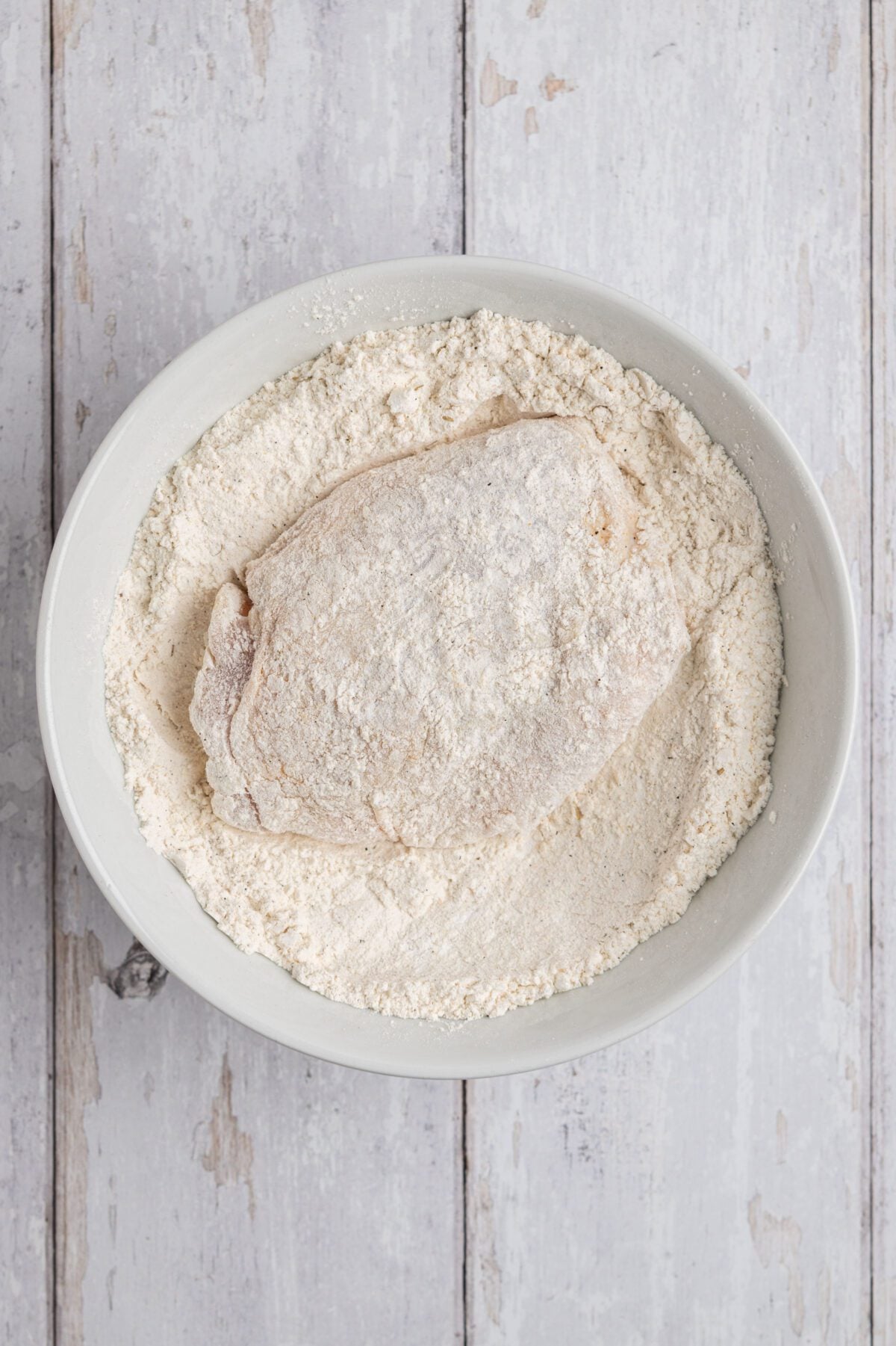 chicken dredged in flour mixture