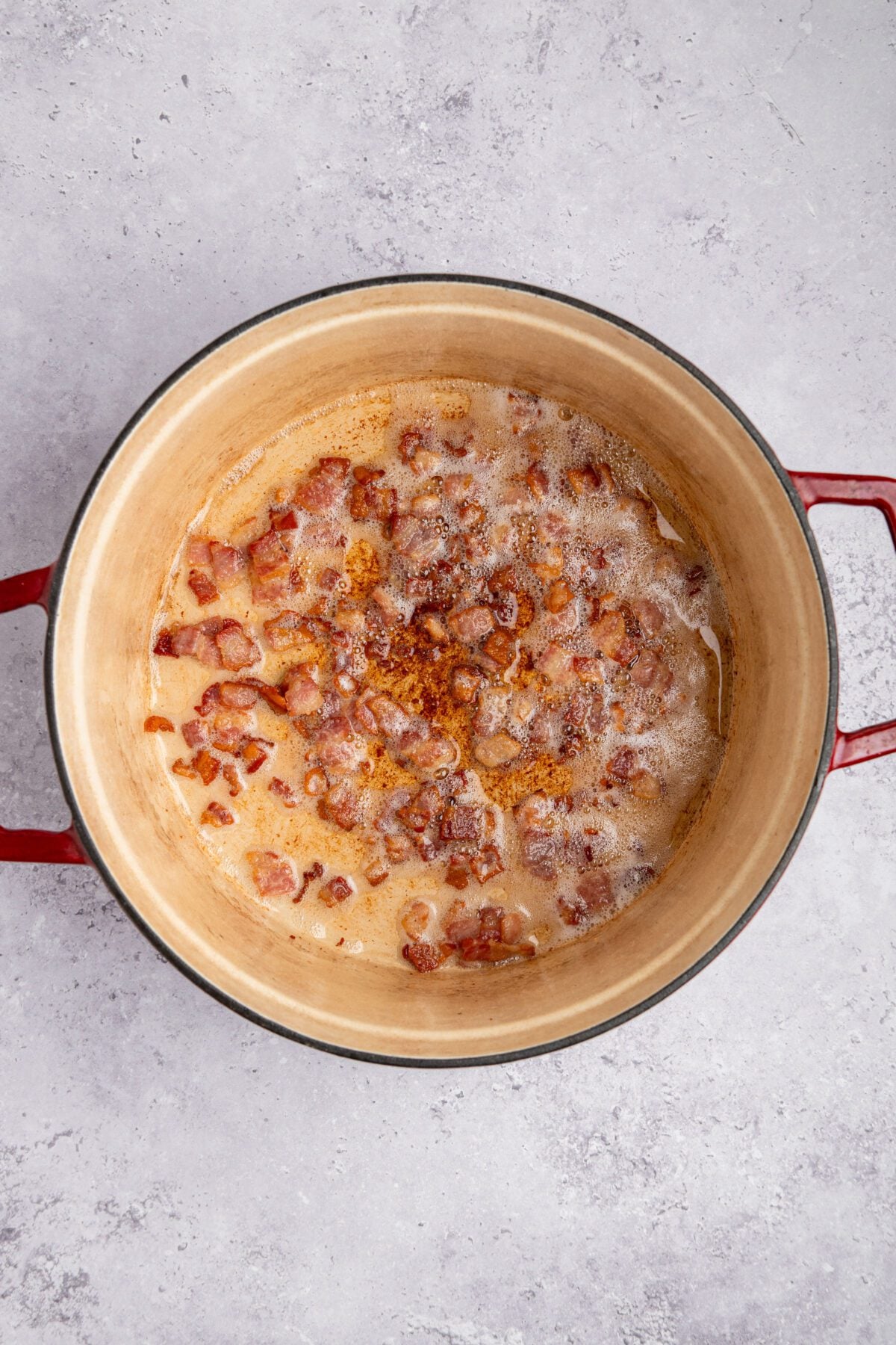 chopped bacon cooking in dutch oven